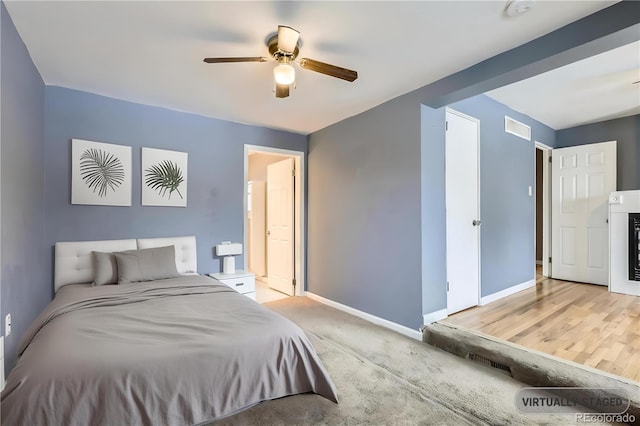 bedroom featuring ceiling fan and light hardwood / wood-style floors