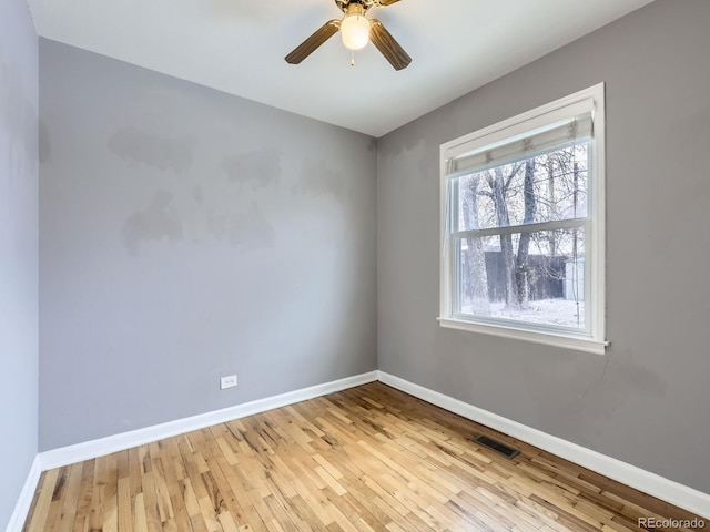 unfurnished room with ceiling fan and light hardwood / wood-style flooring