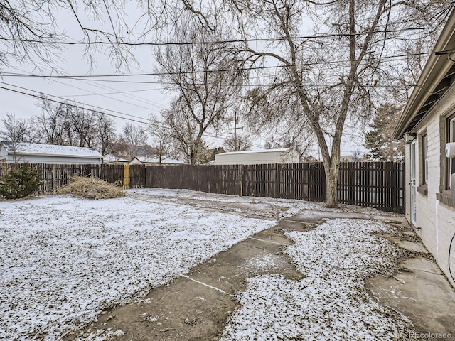 view of yard layered in snow