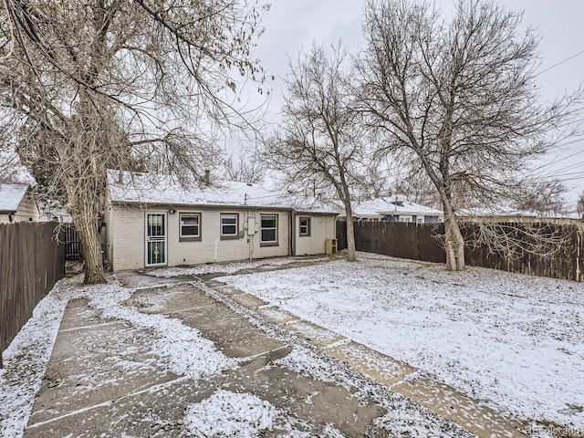 view of snow covered house