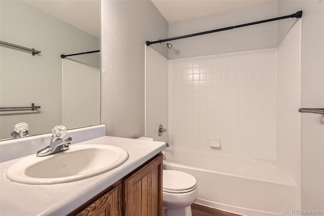 8750 Redwing Ave, Littleton, CO 80126 - bathroom with vanity, toilet, shower / bath combination, and wood finished floors