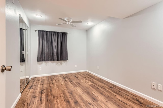8750 Redwing Ave, Littleton, CO 80126 - unfurnished room featuring wood finished floors, a ceiling fan, and baseboards