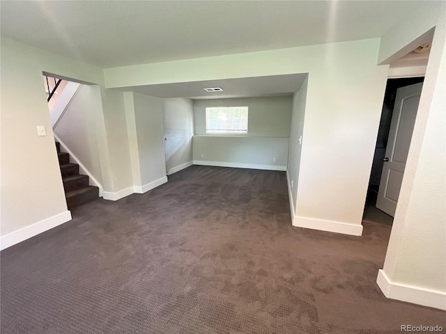 15908 E Flora Pl, Aurora, CO 80013 - basement with dark colored carpet, baseboards, and stairs