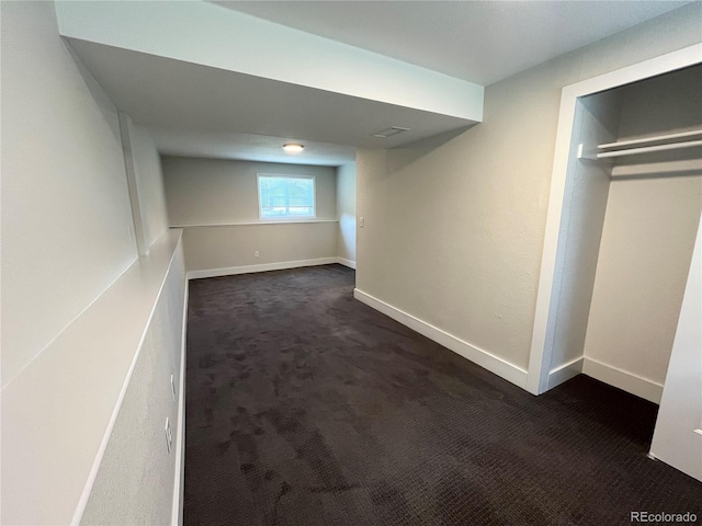 15908 E Flora Pl, Aurora, CO 80013 - below grade area with dark carpet and baseboards