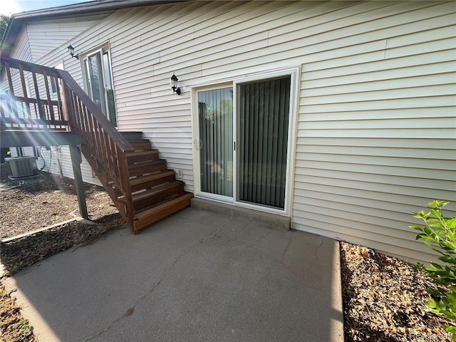 15908 E Flora Pl, Aurora, CO 80013 - doorway to property featuring a patio area, central AC unit, and a deck