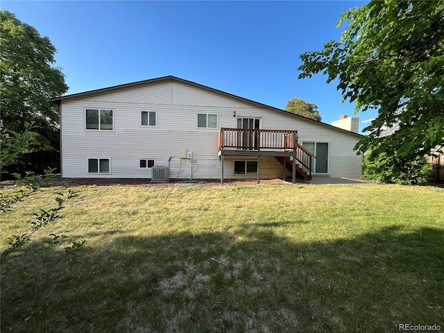 15908 E Flora Pl, Aurora, CO 80013 - rear view of property with stairway, central air condition unit, a wooden deck, a lawn, and a chimney