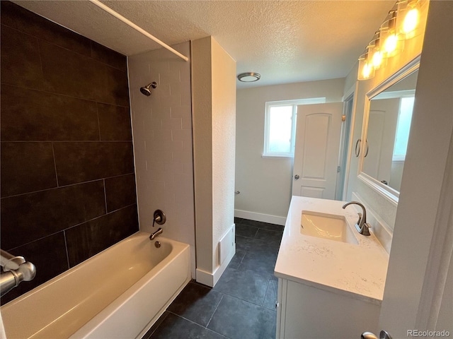 15908 E Flora Pl, Aurora, CO 80013 - full bath featuring a textured ceiling, vanity, tile patterned floors, and bathtub / shower combination