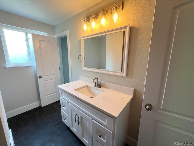 15908 E Flora Pl, Aurora, CO 80013 - bathroom featuring vanity, tile patterned flooring, and baseboards