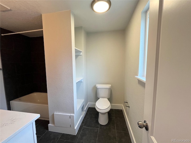 15908 E Flora Pl, Aurora, CO 80013 - bathroom with toilet, vanity, tile patterned floors, shower / bathtub combination, and baseboards