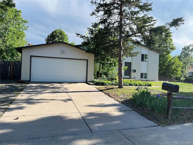 15908 E Flora Pl, Aurora, CO 80013 - view of front facade featuring an outbuilding, driveway, and brick siding