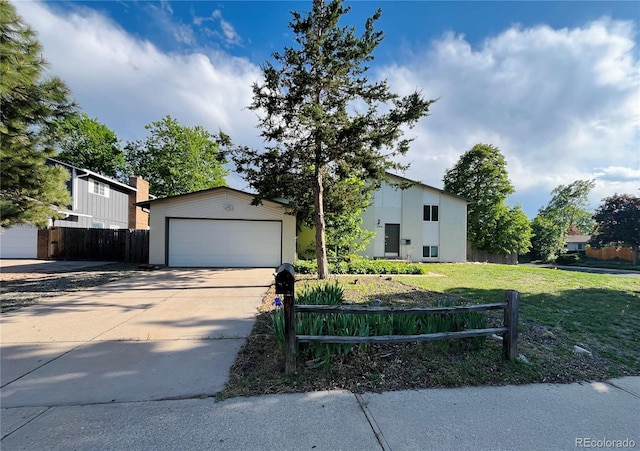 15908 E Flora Pl, Aurora, CO 80013 - view of front facade featuring a garage, driveway, an outbuilding, and a chimney