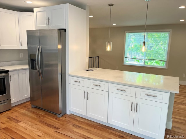 15908 E Flora Pl, Aurora, CO 80013 - kitchen with stainless steel appliances, a peninsula, white cabinets, light wood finished floors, and recessed lighting
