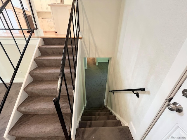 15908 E Flora Pl, Aurora, CO 80013 - stairway featuring carpet and baseboards