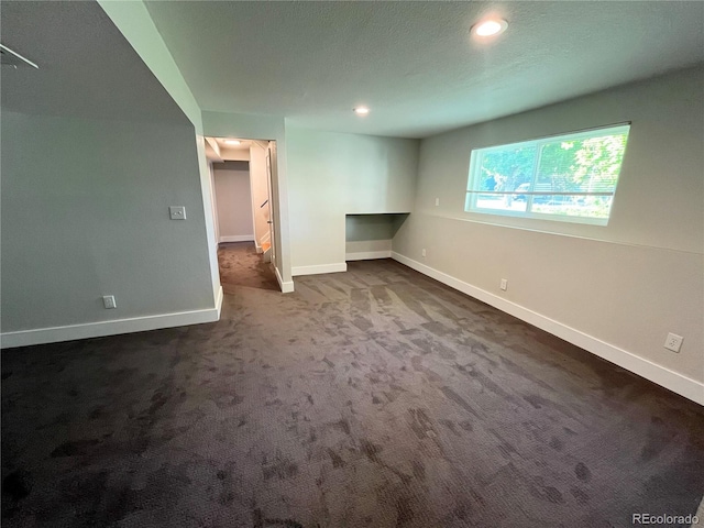 15908 E Flora Pl, Aurora, CO 80013 - unfurnished bedroom featuring dark colored carpet, baseboards, and recessed lighting