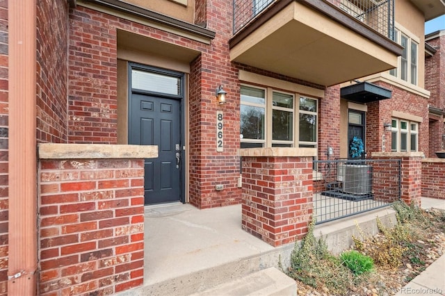 entrance to property with brick siding