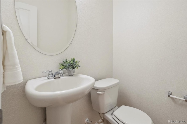 bathroom featuring toilet