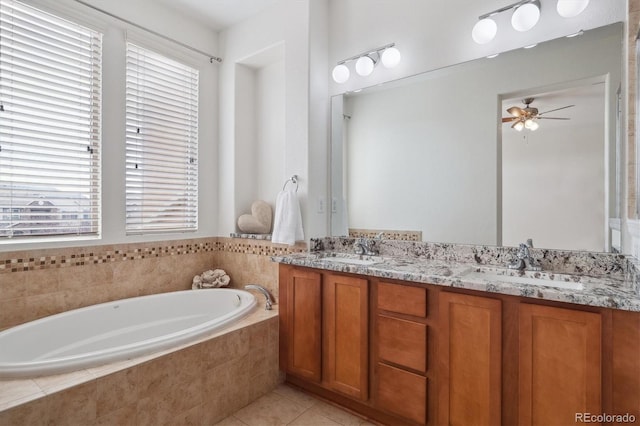 full bathroom featuring a bath, plenty of natural light, and a sink