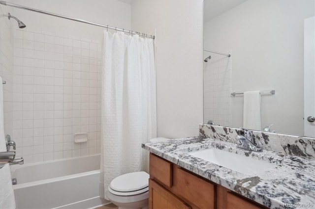 bathroom with shower / bath combo, toilet, and vanity