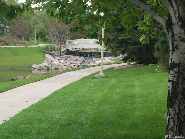 view of home's community featuring a lawn