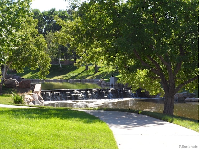 surrounding community featuring a water view
