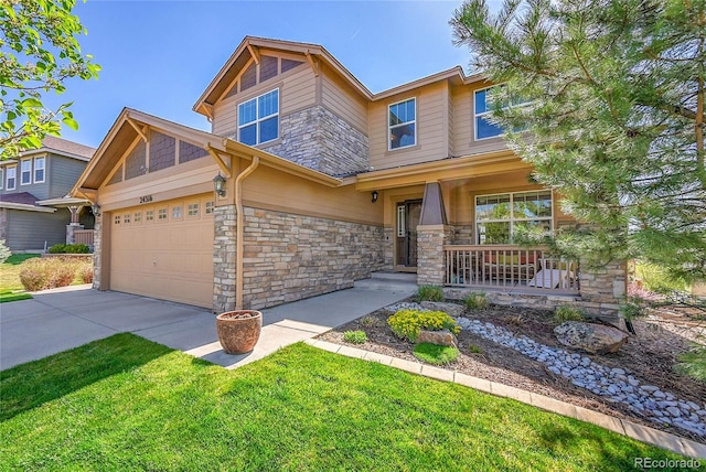 craftsman inspired home featuring covered porch, a front yard, driveway, and stone siding