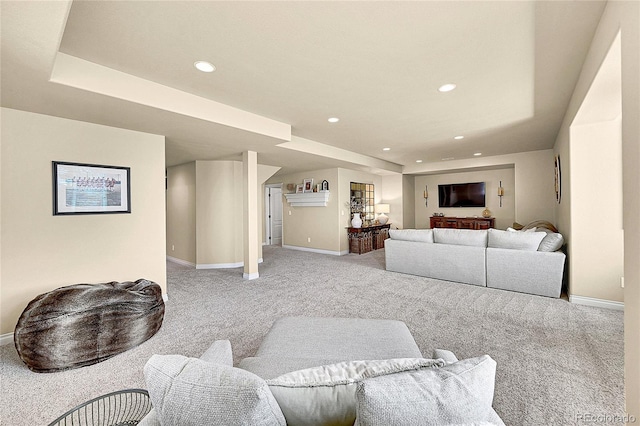 living room with baseboards, light carpet, and recessed lighting