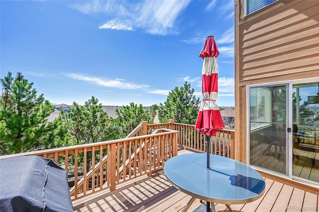 wooden deck featuring outdoor dining area and area for grilling