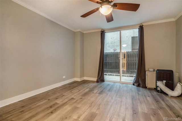 spare room with heating unit, light hardwood / wood-style flooring, ceiling fan, and ornamental molding