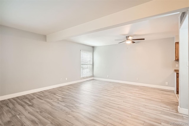 unfurnished room with ceiling fan, light wood-style flooring, and baseboards