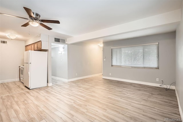 unfurnished living room featuring a ceiling fan, light wood-type flooring, and baseboards