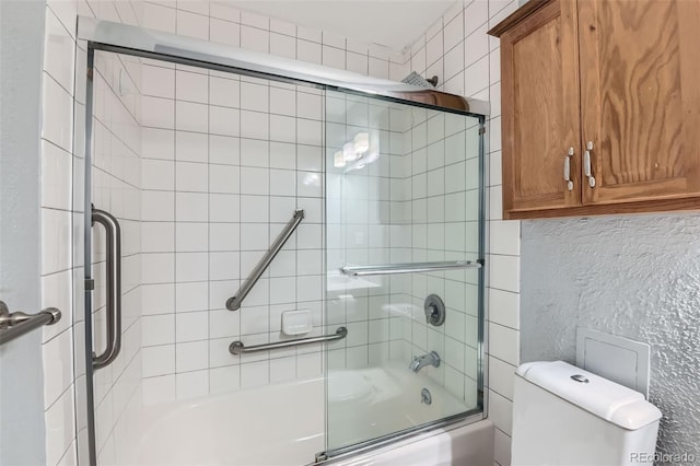 3663 S Sheridan Blvd Unit J12, Denver, CO 80235 - full bathroom with toilet and bath / shower combo with glass door