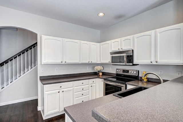 kitchen featuring white cabinetry, appliances with stainless steel finishes, and sink