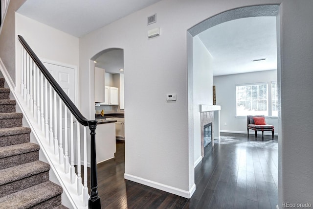 interior space with dark hardwood / wood-style flooring