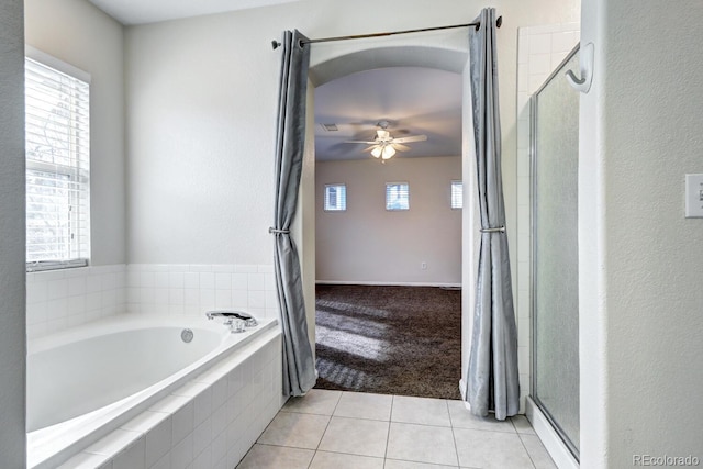 bathroom with a healthy amount of sunlight, tile patterned floors, and ceiling fan