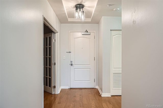 entryway featuring wood finished floors and baseboards