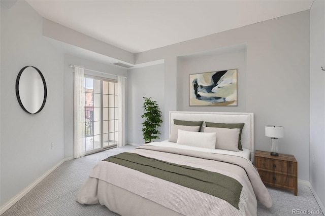 carpeted bedroom with baseboards