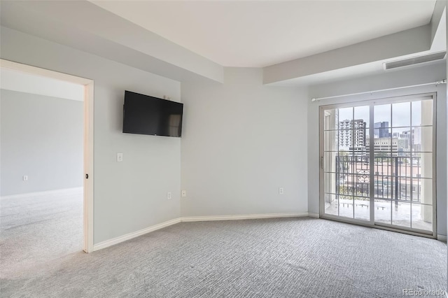 empty room with carpet floors and baseboards