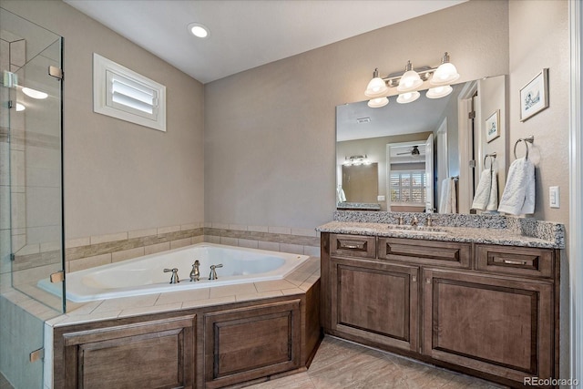 bathroom with tile patterned floors, ceiling fan, vanity, and independent shower and bath