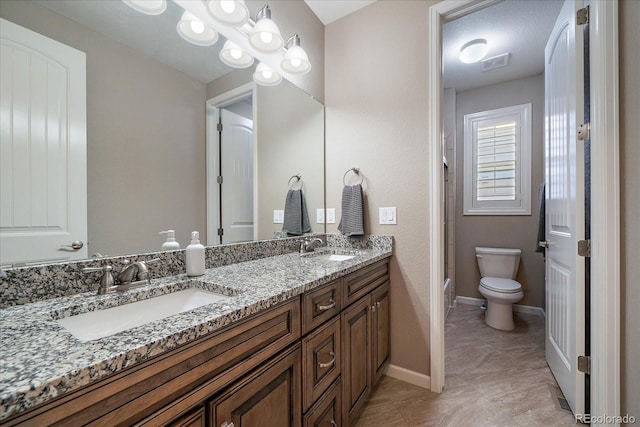 full bathroom featuring shower / washtub combination, vanity, and toilet