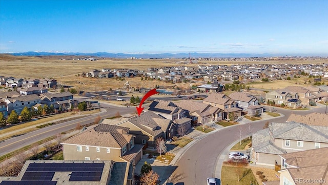 birds eye view of property with a mountain view