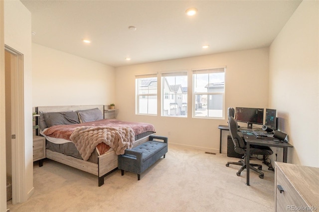 9152 Gladiola Way Unit E, Arvada, CO 80005 - bedroom featuring light carpet, a desk, recessed lighting, and baseboards