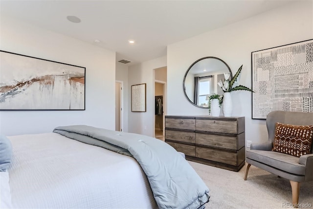 bedroom with light carpet