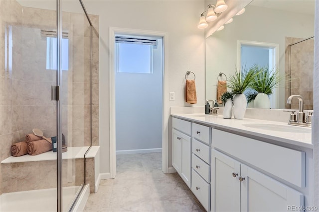 bathroom featuring vanity and an enclosed shower