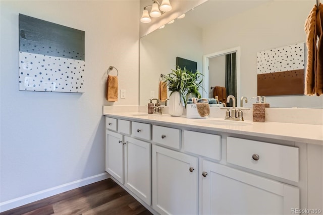 bathroom with vanity and hardwood / wood-style floors