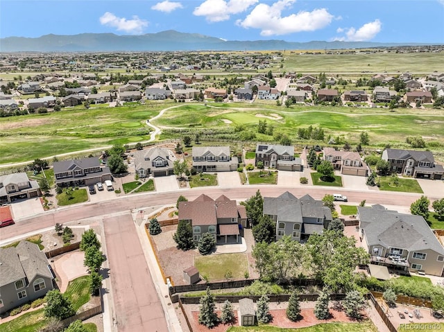9005 Royal Melbourne Cir, Peyton, CO 80831 - aerial view of residential area with a mountain backdrop and a local golf course