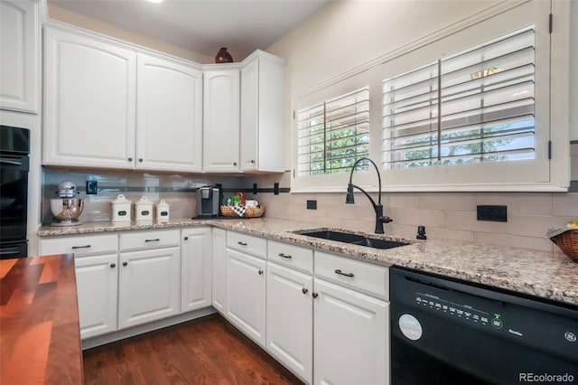 9005 Royal Melbourne Cir, Peyton, CO 80831 - kitchen featuring black appliances, decorative backsplash, white cabinets, dark wood-style floors, and light stone countertops