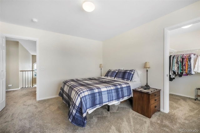 9005 Royal Melbourne Cir, Peyton, CO 80831 - carpeted bedroom with a walk in closet and baseboards
