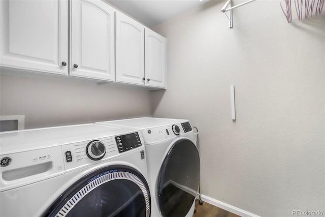 9005 Royal Melbourne Cir, Peyton, CO 80831 - washroom featuring washing machine and dryer, cabinet space, and wood finished floors