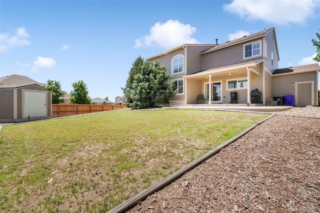 9005 Royal Melbourne Cir, Peyton, CO 80831 - rear view of house featuring a shed and a patio area