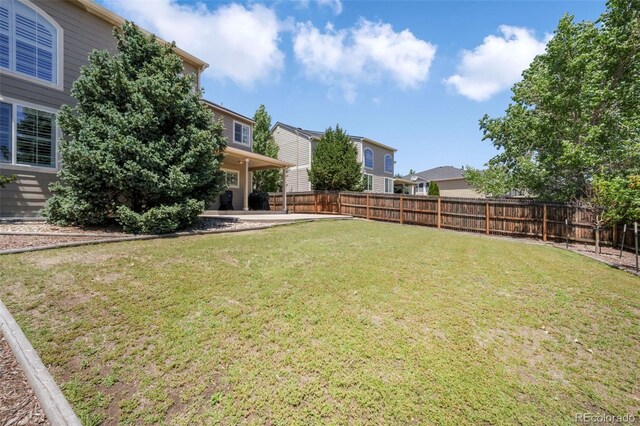 9005 Royal Melbourne Cir, Peyton, CO 80831 - fenced backyard with a patio